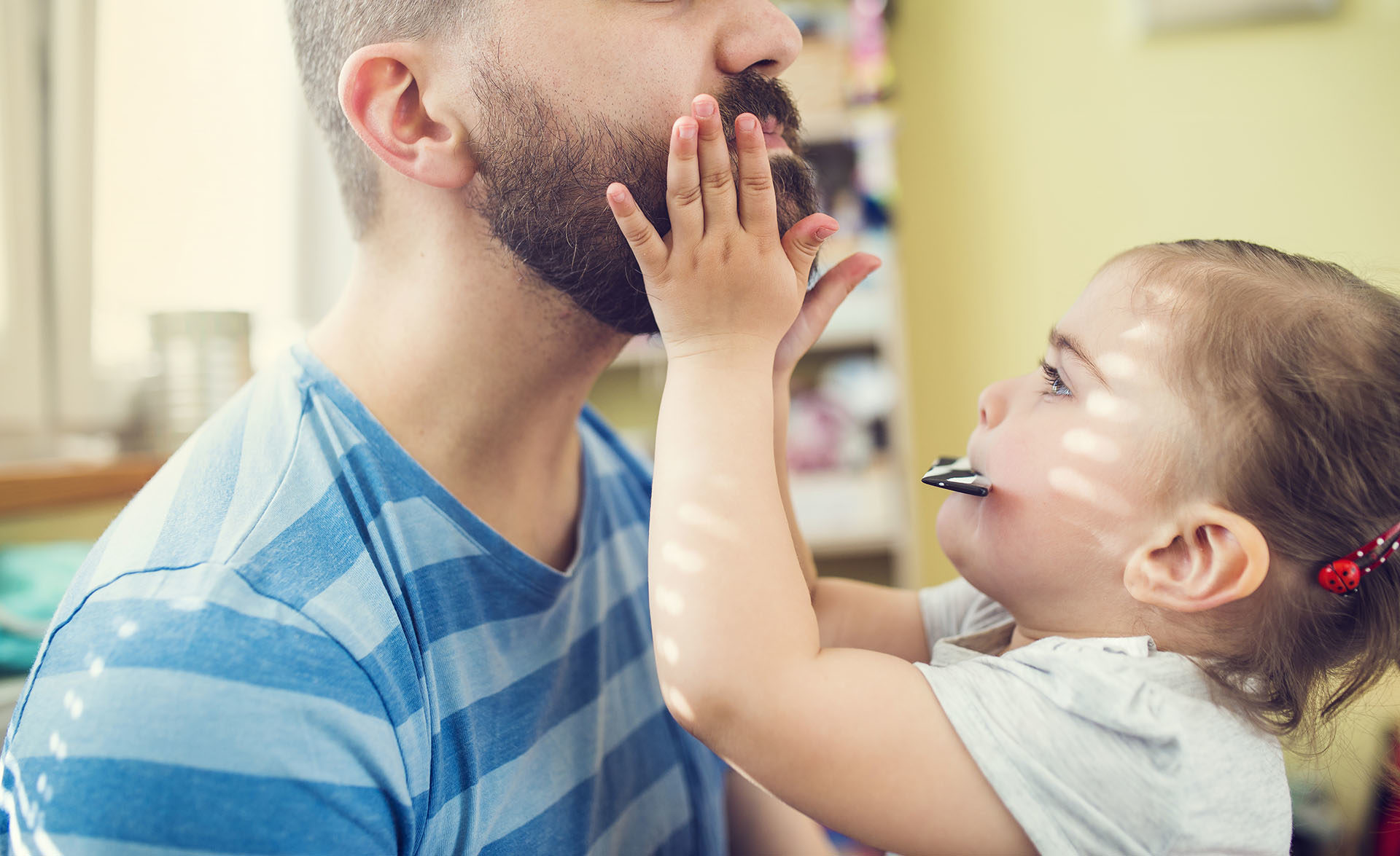 girl fixing dads beard