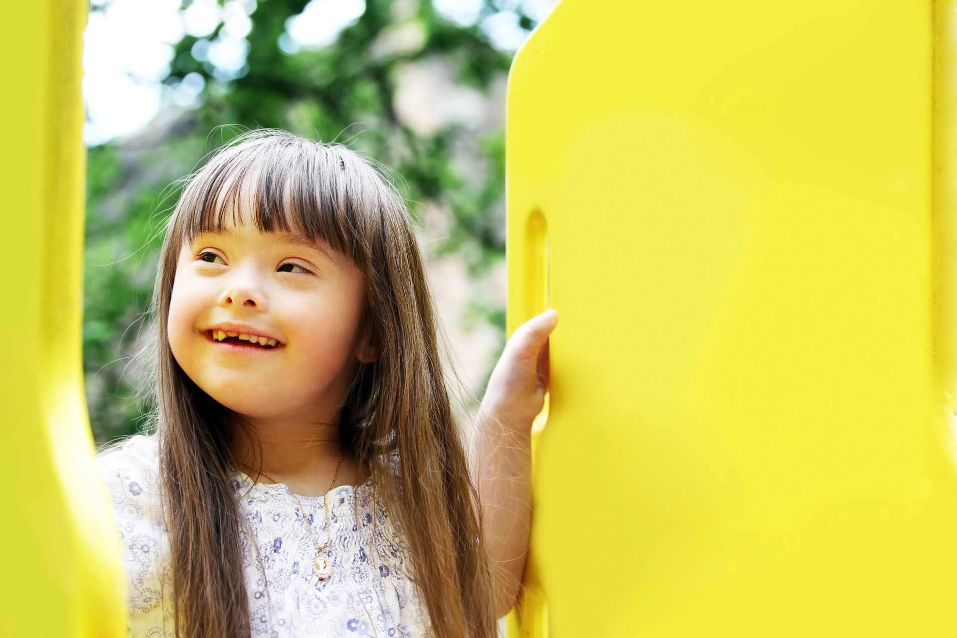 girl playing on yellow frame