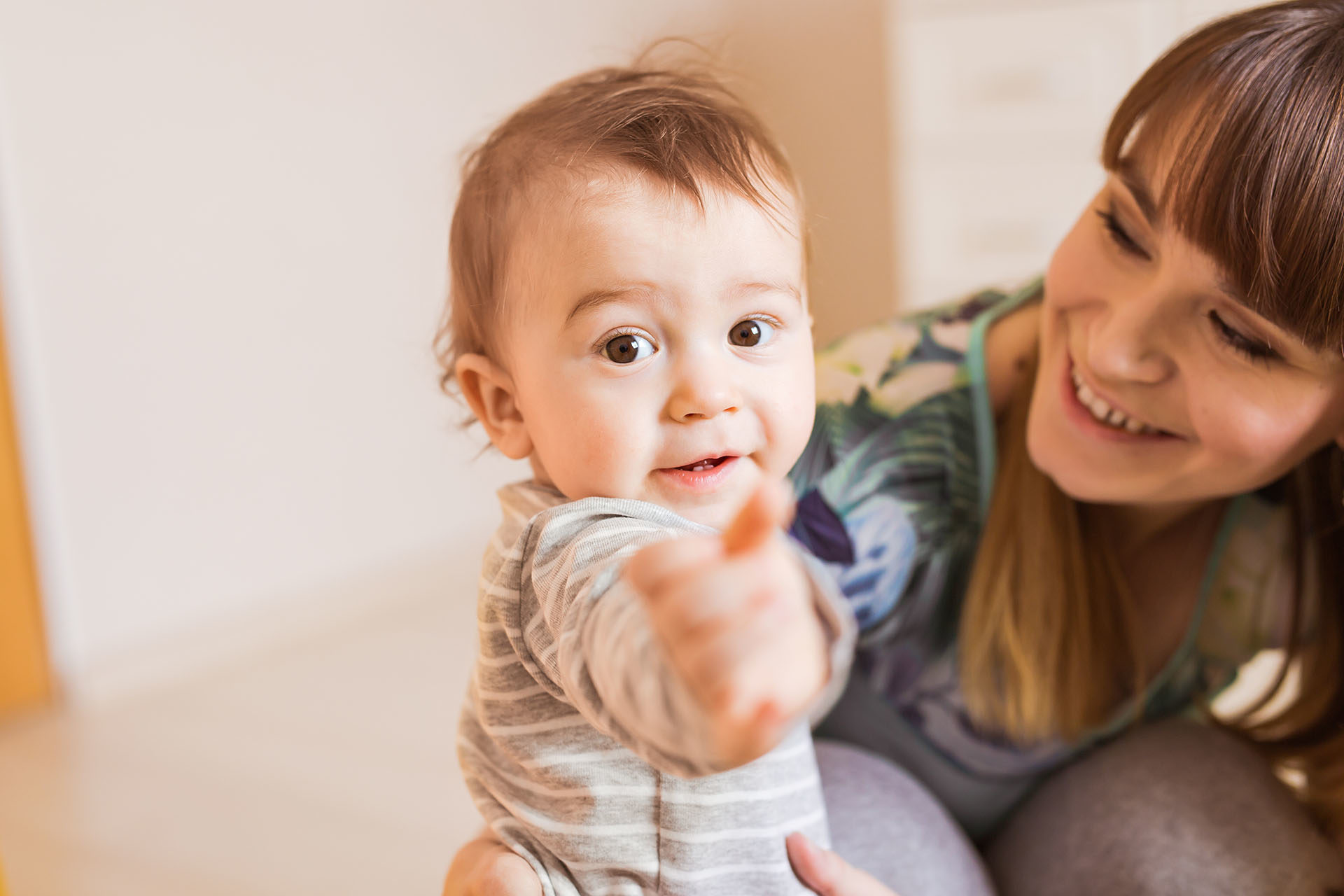 young child reaching for camera