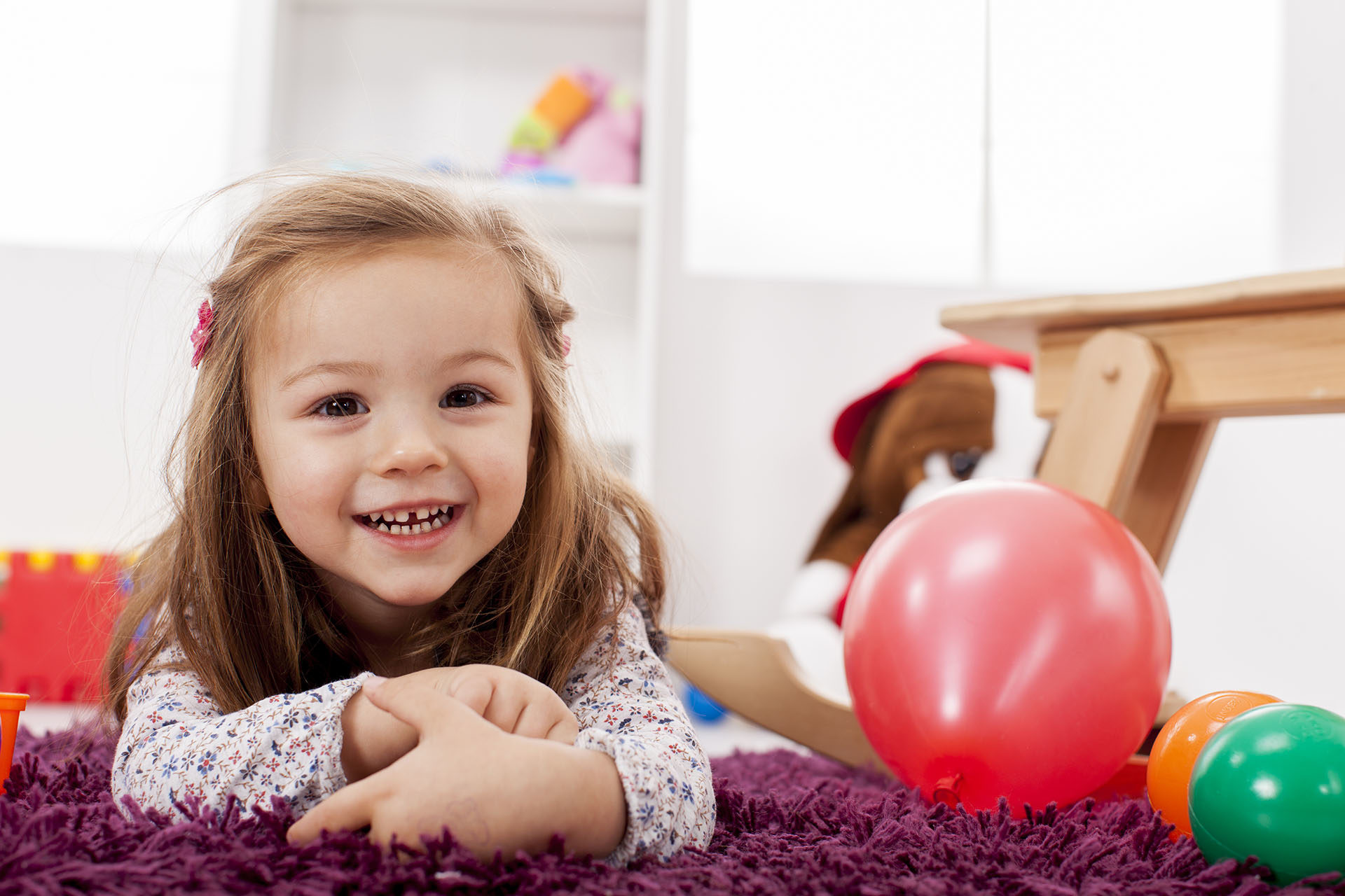 young girl lying on floor