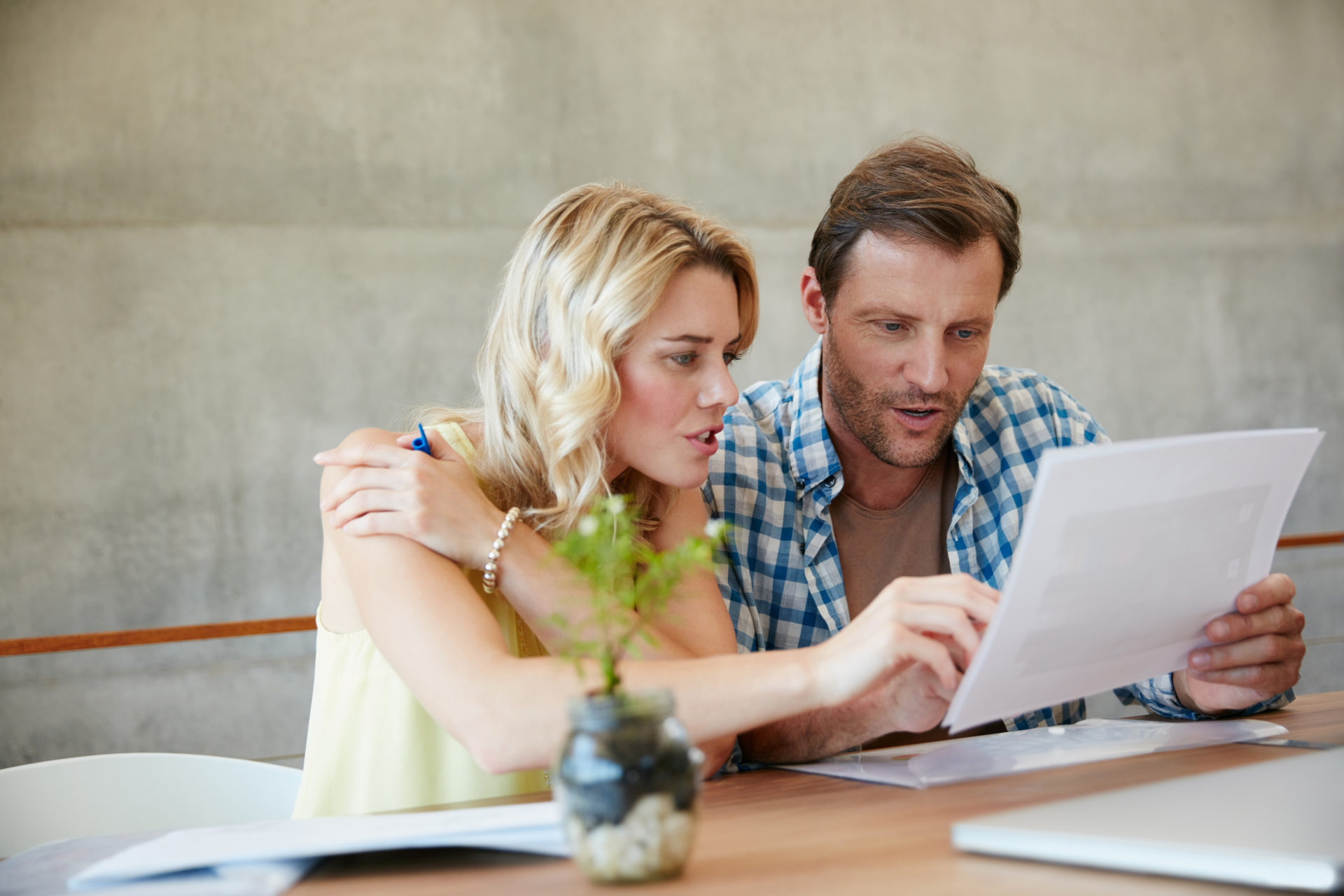 Shot of a couple going through their paperwork together at home