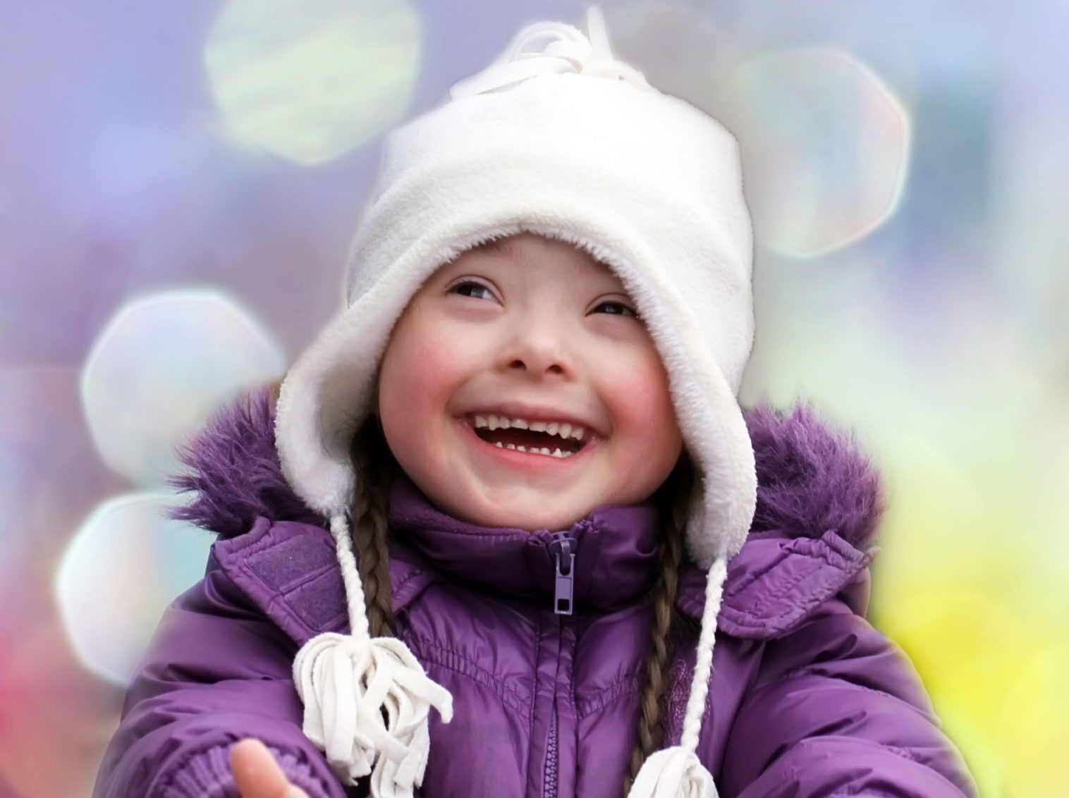 Portrait of beautiful happy girl giving thumbs up.