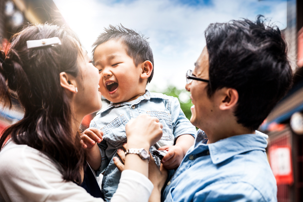 Happy family spending a weekend together with little kid.