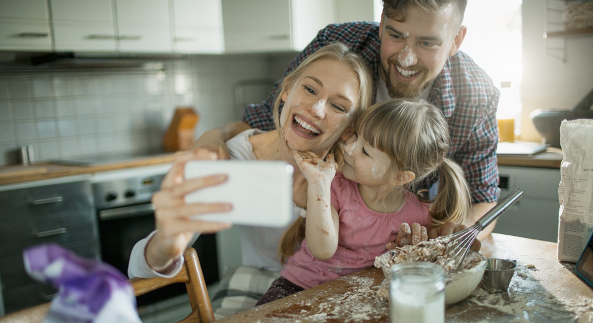 Close up of a young family enjoying baking together