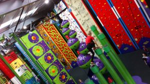 Small child in red t shirt climbing the Stairway to Heaven in Clip 'n Climb at High Rise Lisburn