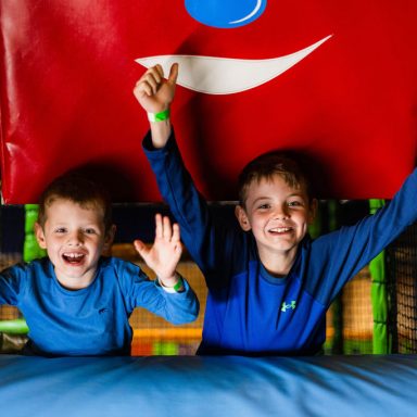 Young boys cheering for free soft play day at High Rise Lisburn